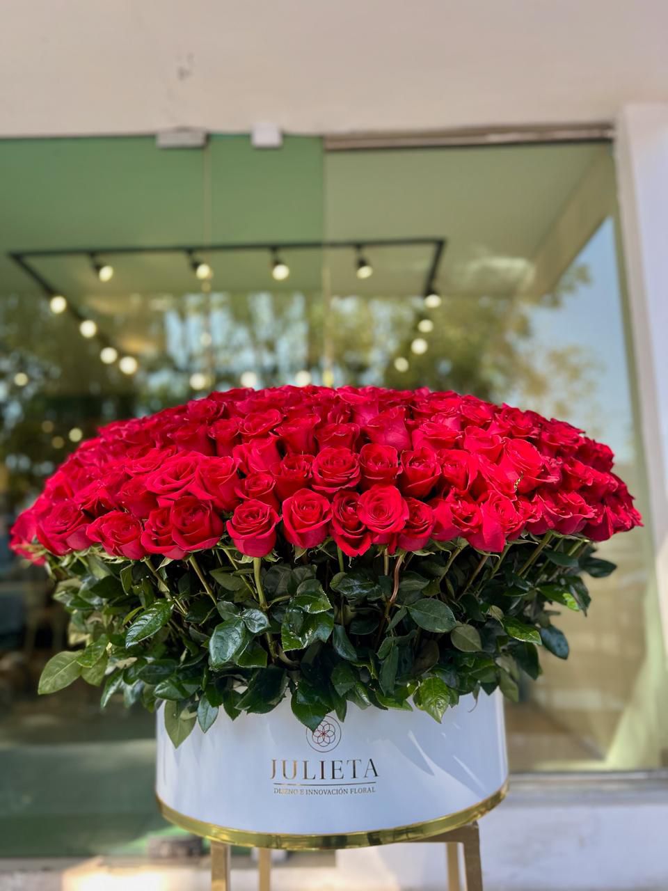 Exclusive Arrangement of Red Roses on a Premium White Base